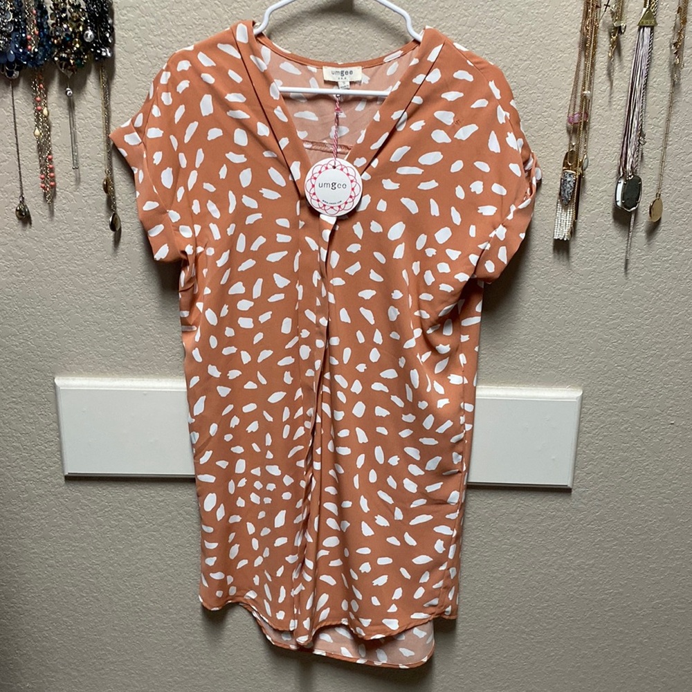 Cute, flowy, t-shirt style dress. 100%Polyester.